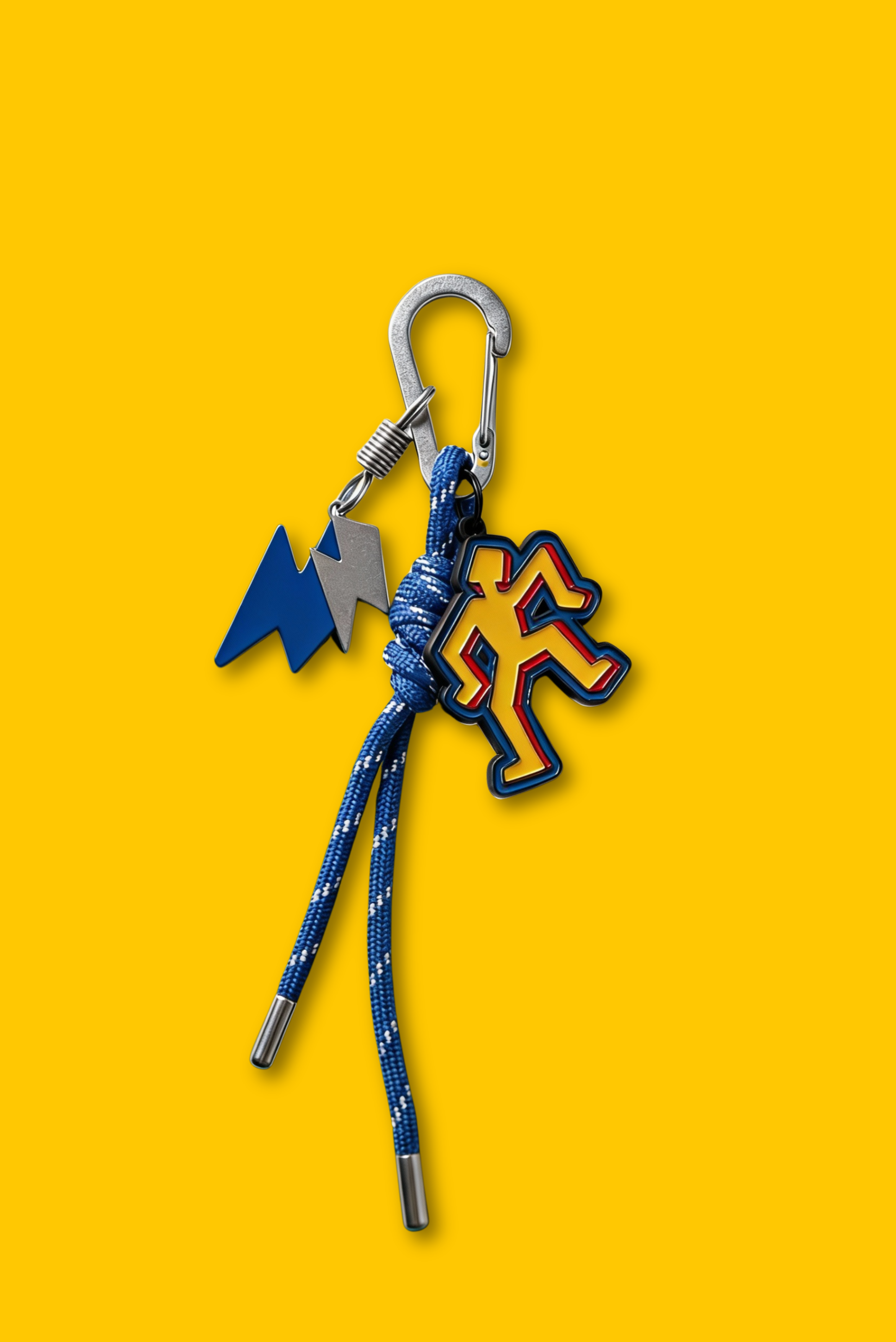 A multi-charm keychain hanging from a handbag