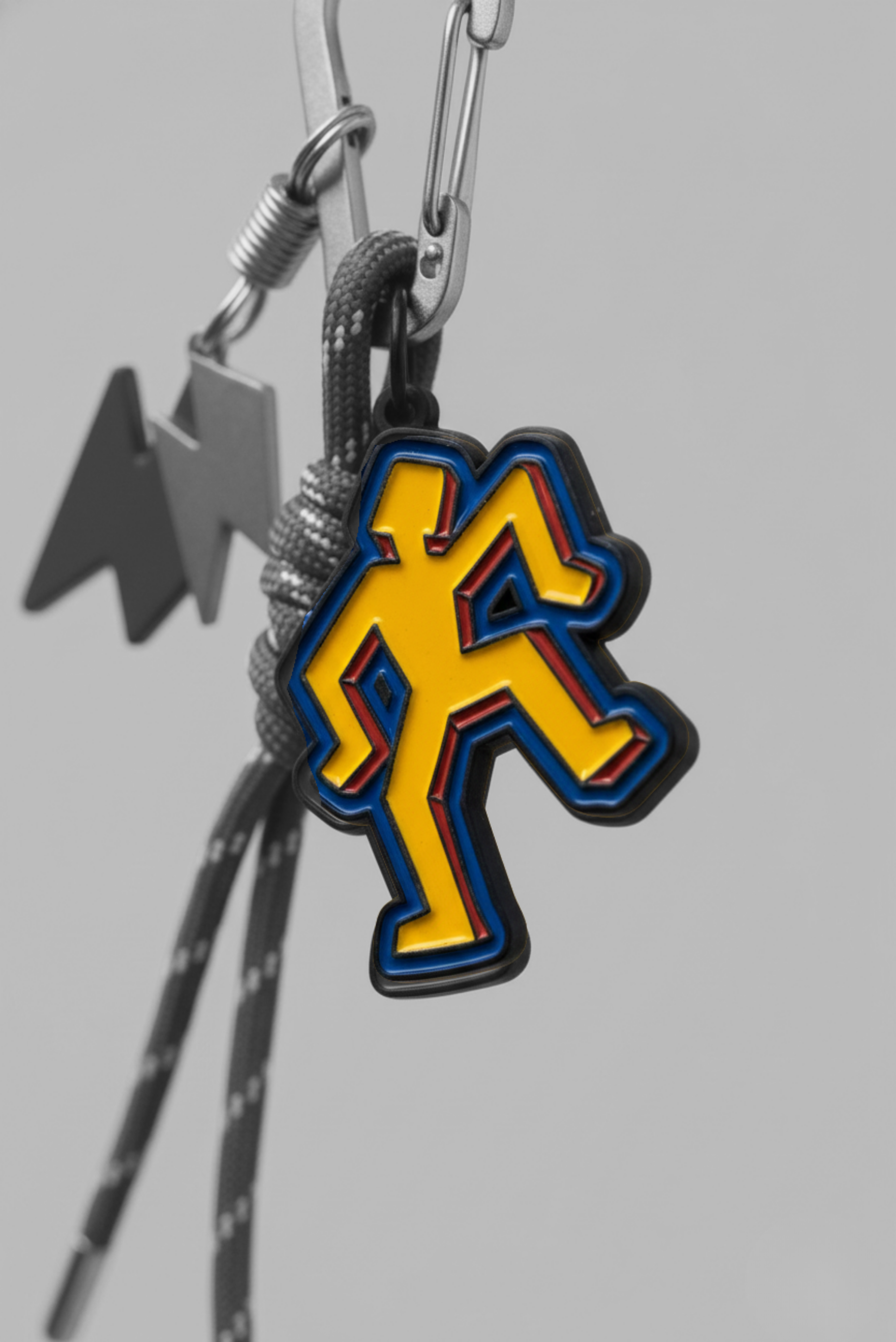A bag charm keyring shown on its own
