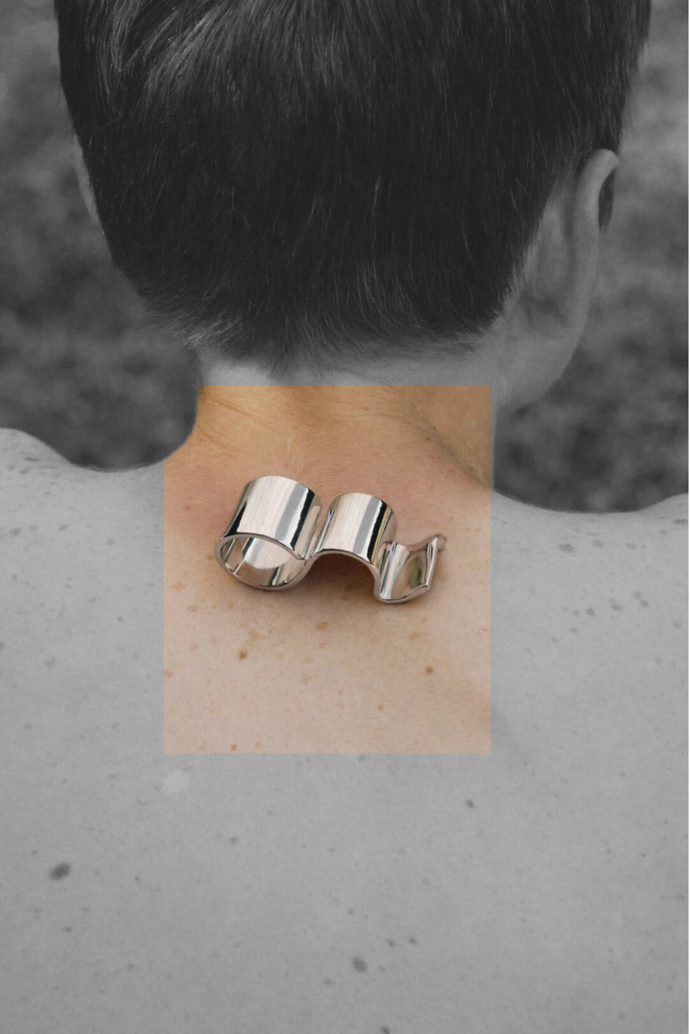 A bold multi-finger statement ring shown on its own