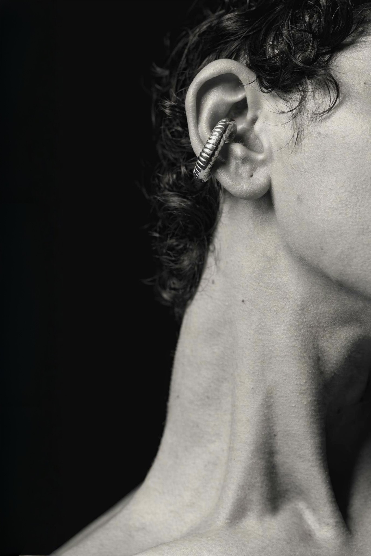 A model wearing an oversized statement ear cuff
