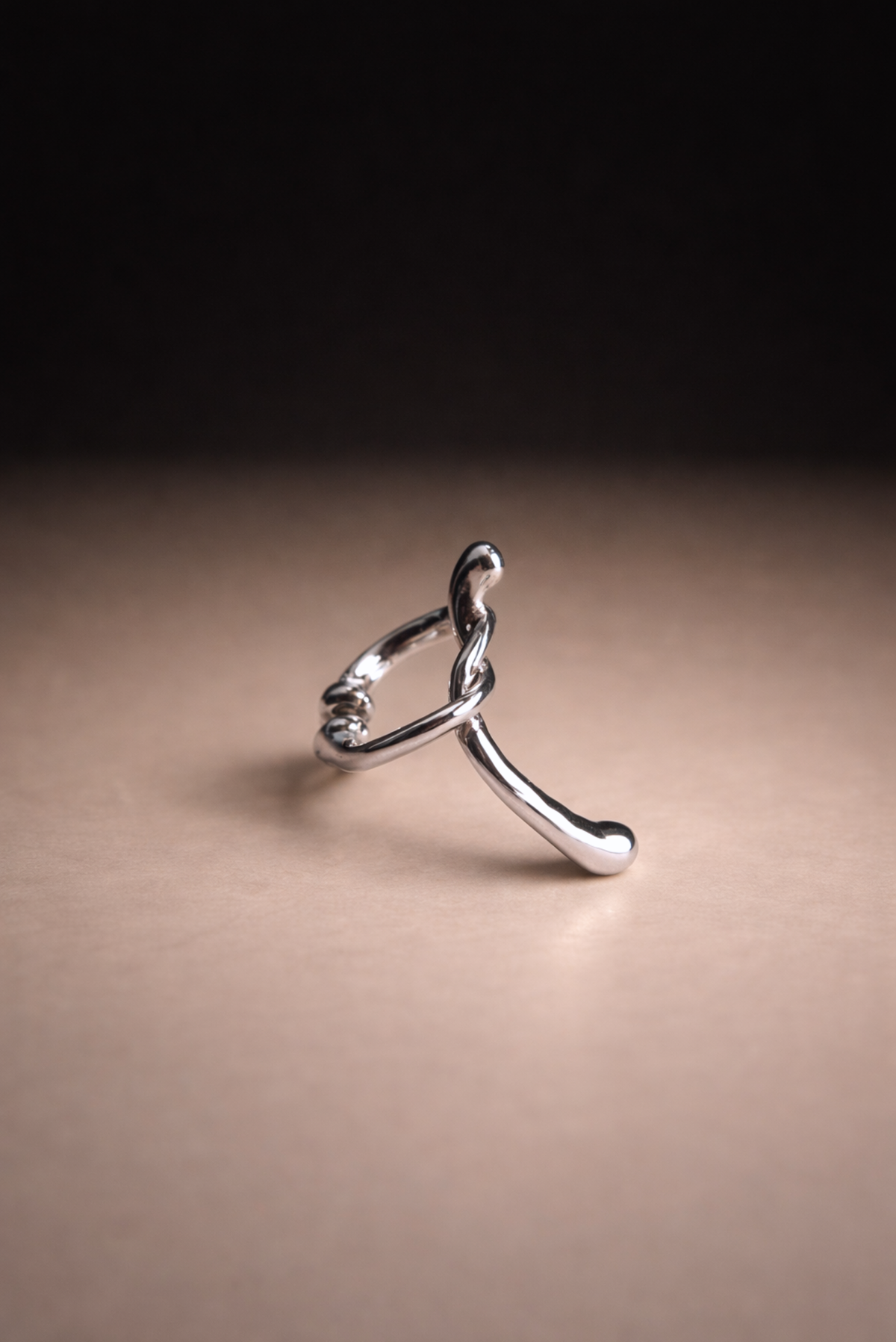 A two-piece silver statement ear cuff set styled together