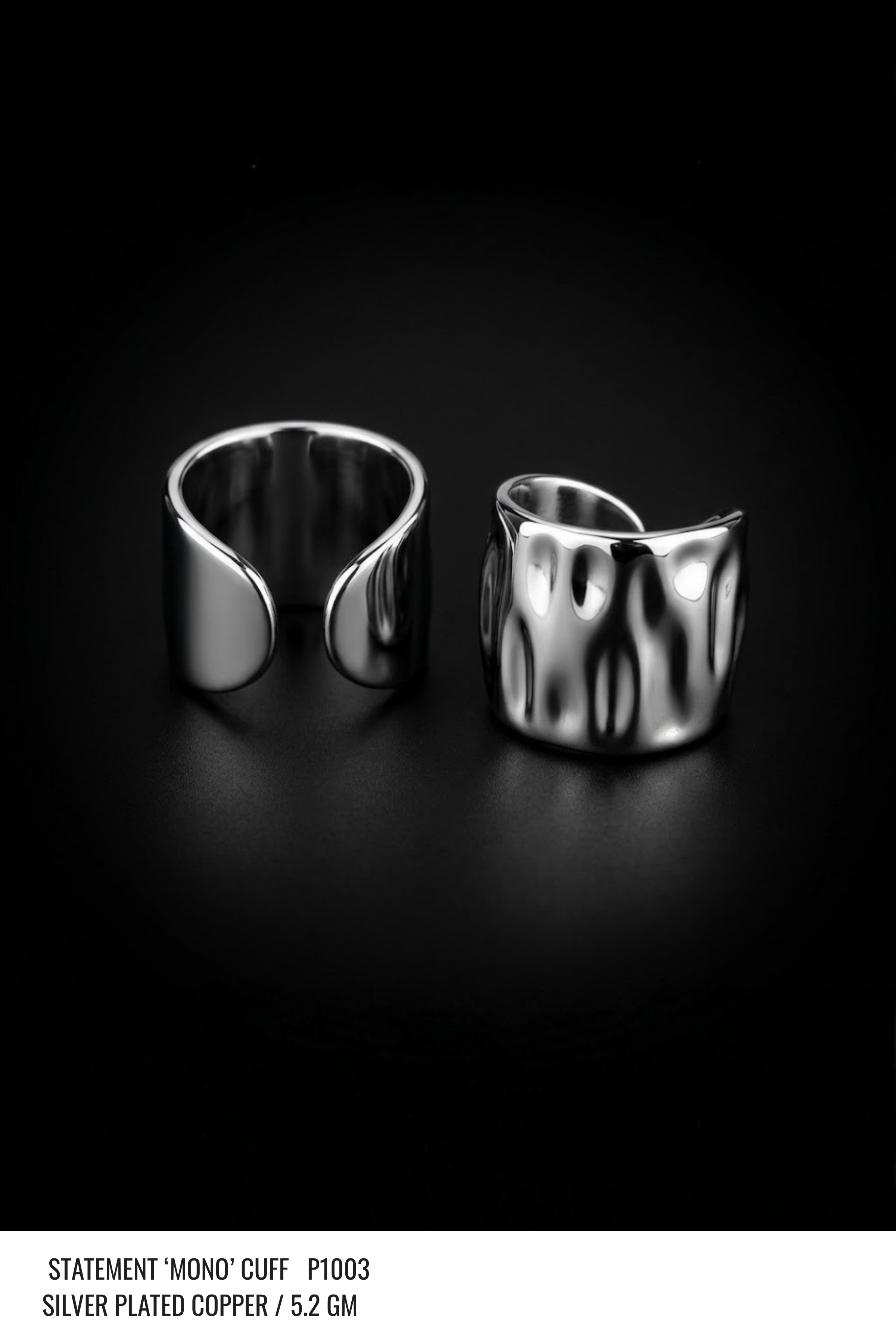 A minimal silver ear cuff shown on its own against a plain background