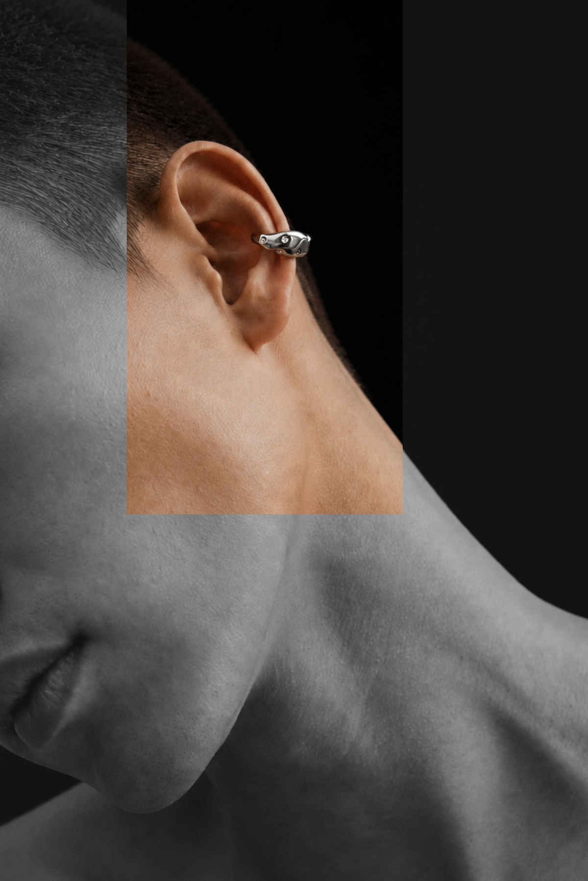 A slim silver statement ear cuff worn on the outer ear