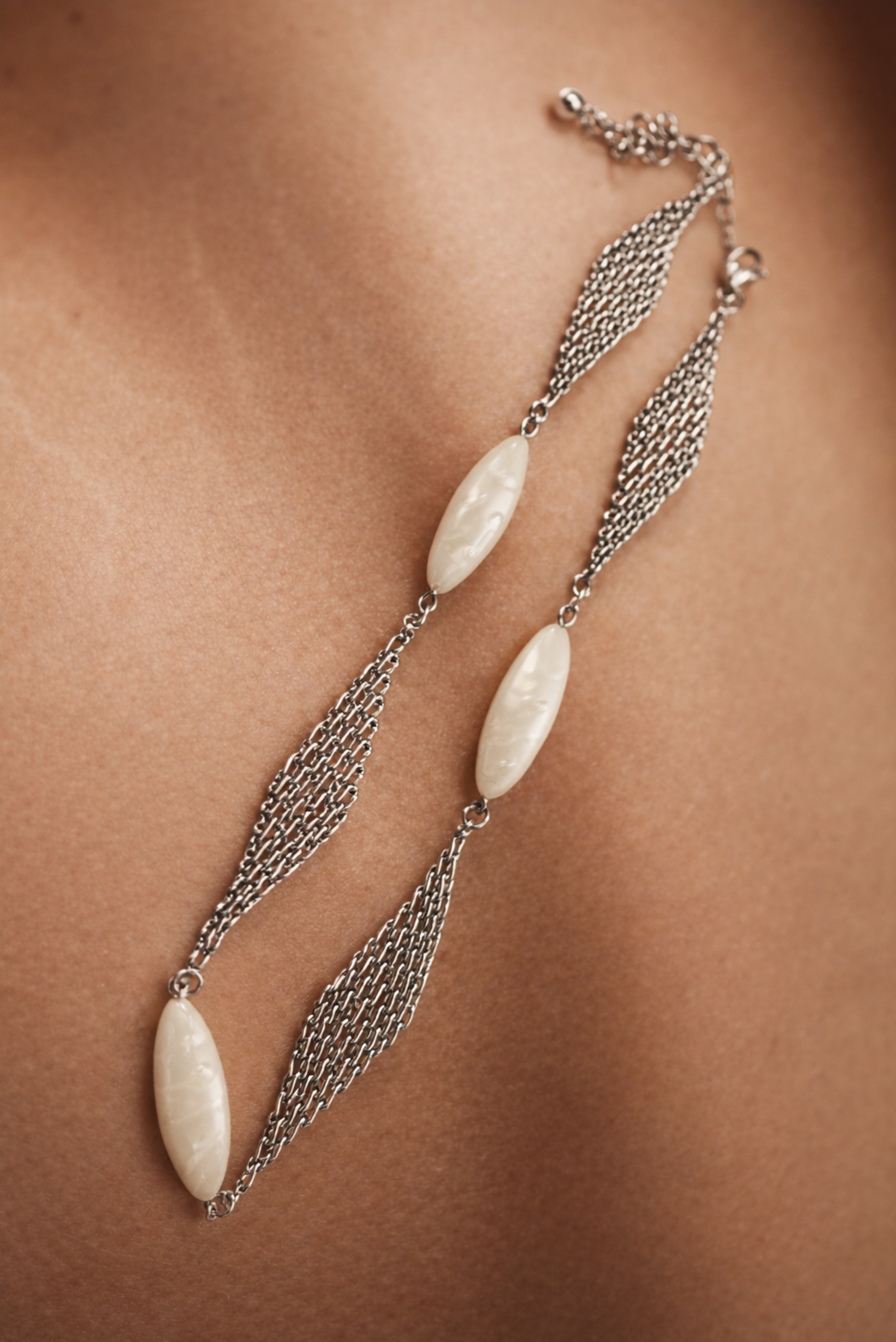 A long layered pearl necklace shown on its own