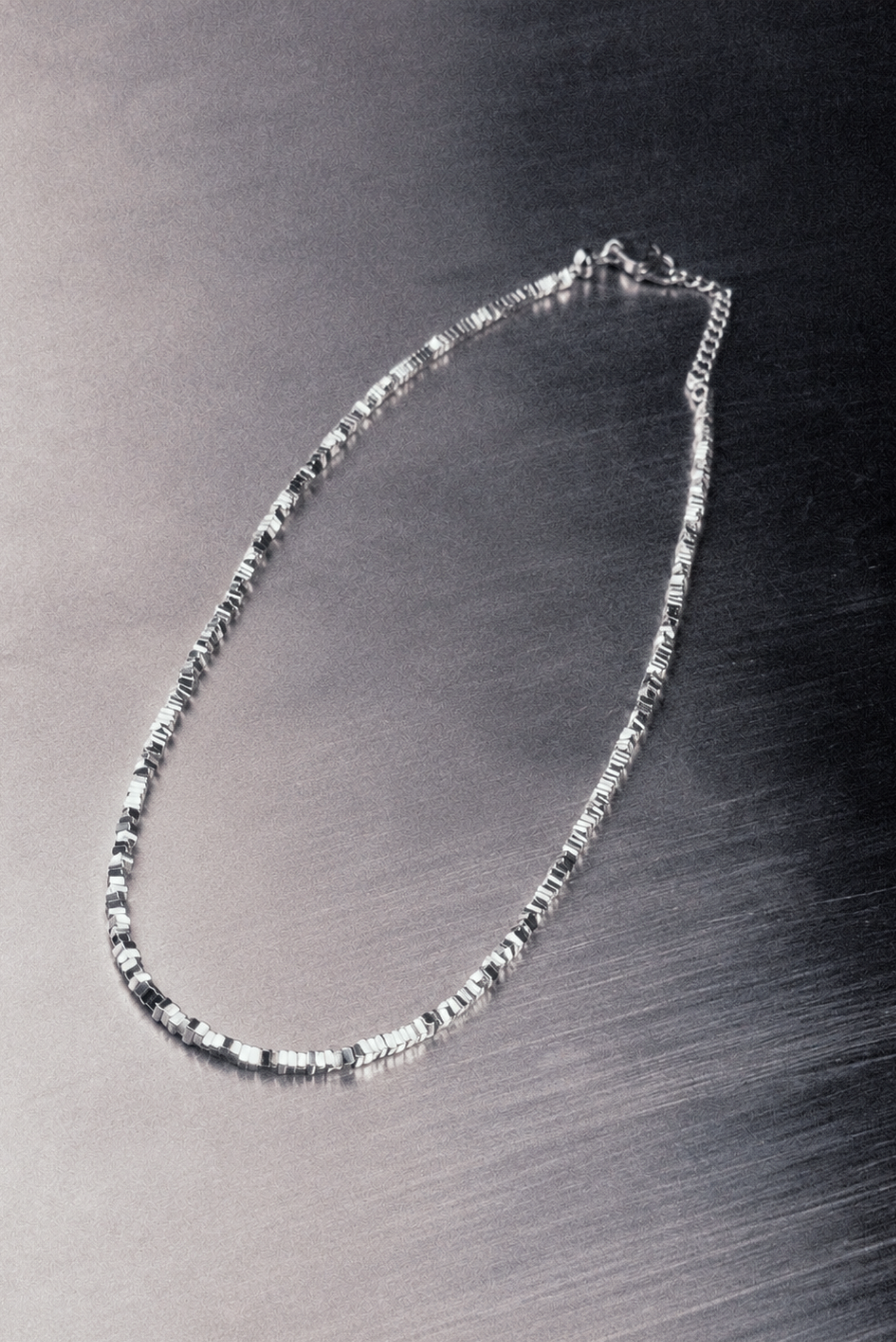 A sculptural bib statement necklace worn on the neck