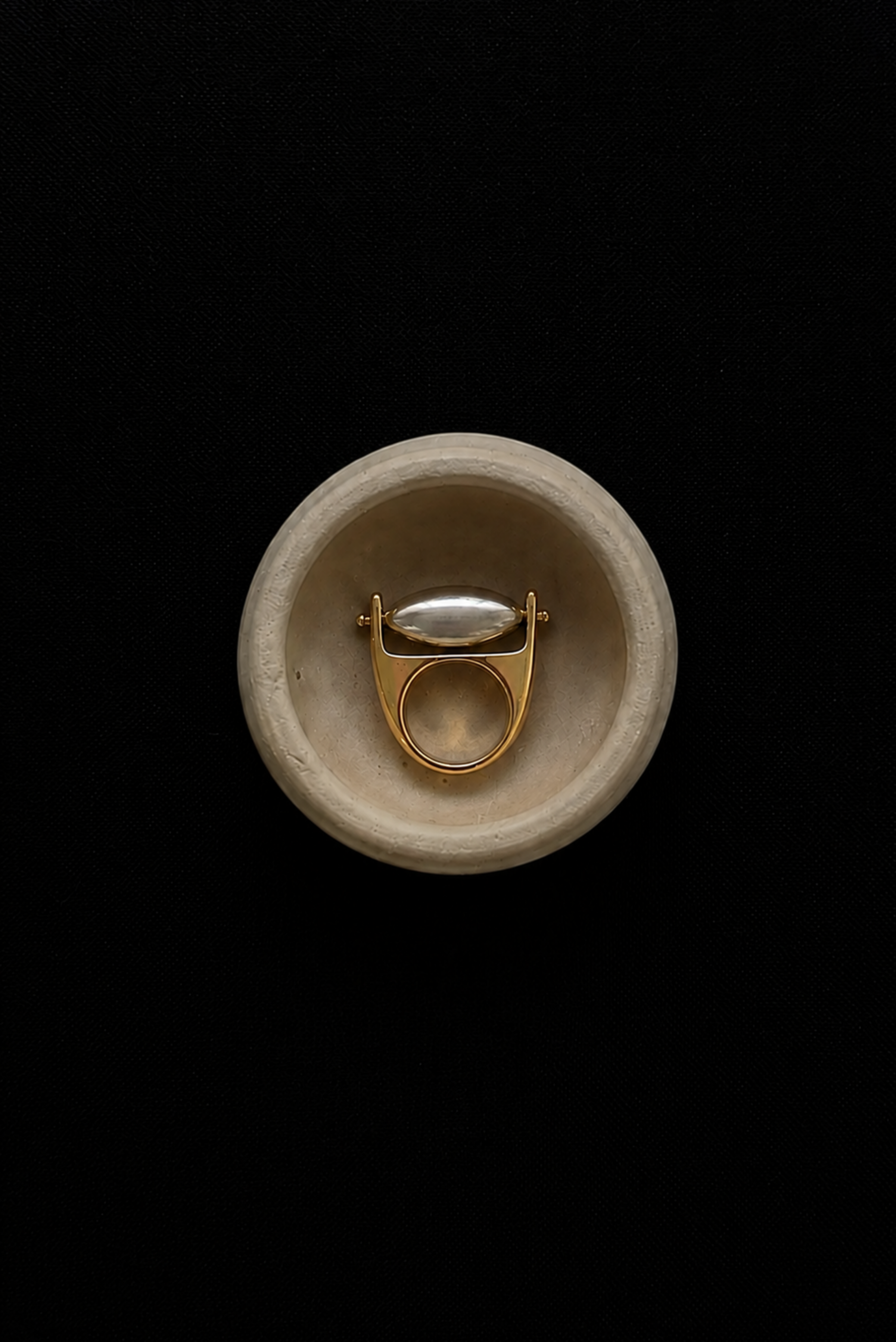A heavy statement ring styled for a streetwear look