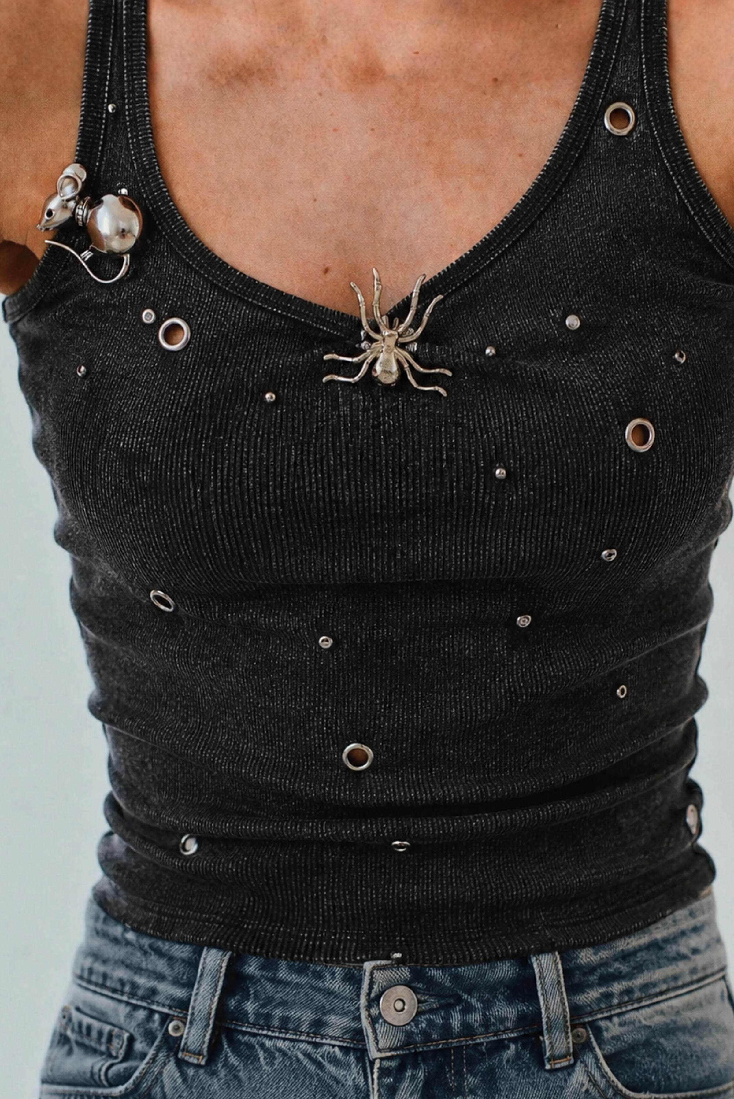 A metal statement brooch worn on a jacket