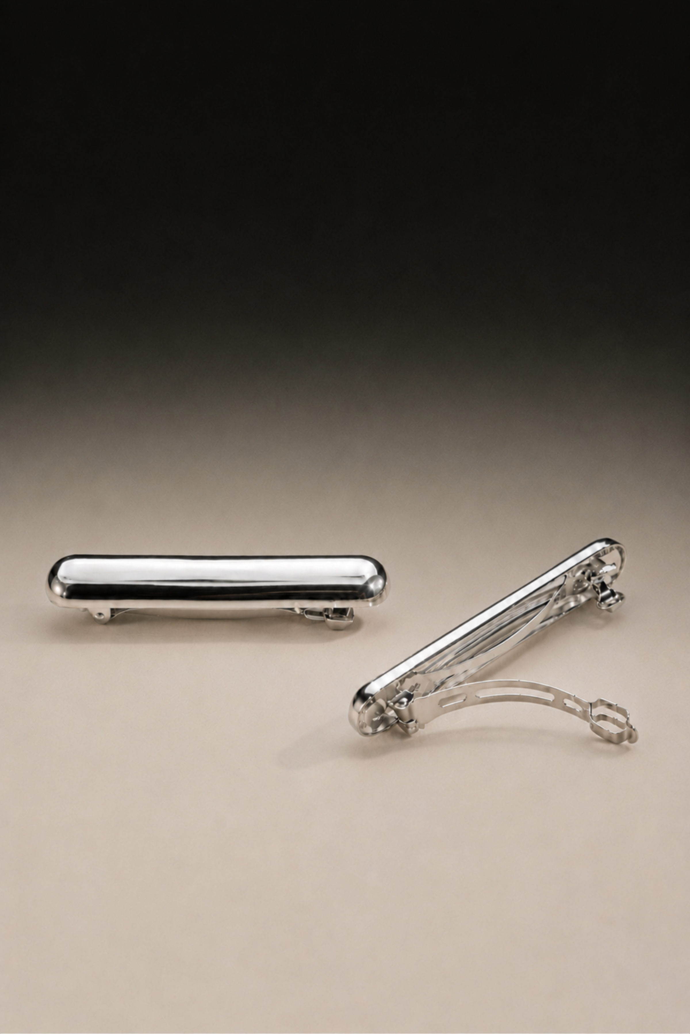A silver hair clip shown on its own against a plain background